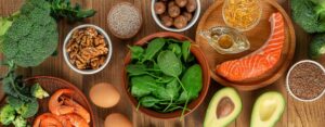 Whole foods rich in B-vitamins — eggs, salmon, leafy greens, meat, nuts, and whole grains.