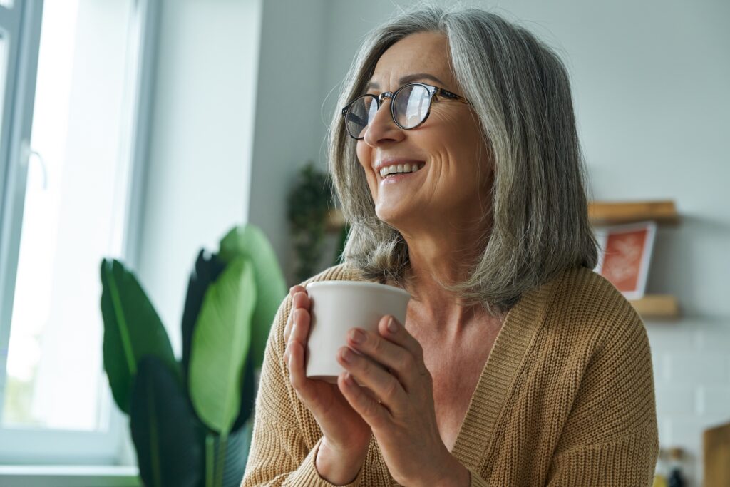 A quiet morning moment representing mental clarity — soft sunlight and a warm drink.