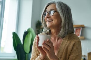 A quiet morning moment representing mental clarity — soft sunlight and a warm drink.